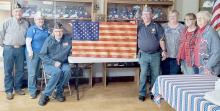 Prior to the Legion and Auxiliary meetings, a special presentation was made by SAL member Michael Rudnick. Jerry Clausen from Lincoln, NE had handmade a wooden flag and donated it to the Legion Post 79. This was done in memory of his father, Jack Clausen, a WWII Veteran in the US Army. Accepting the Flag donation were: (Left to Right) Legion Members Wes Luther, Judy Walters, and Jack Anderson; SAL member Michael Rudnick; Legion Auxiliary members Marilyn Anderson, Cheri Coutts and Alice Mitchell.