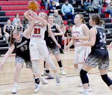 Madelyn Goochey is fouled by Boyd County’s Addison Birmeier while going for two. Goochey made her free throws to help Ainsworth in their 52-36 win over Boyd County.