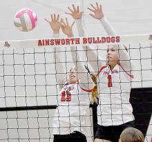 Kaitlyn Sease and Kendyl Delimont block back one of Boyd County’s hits to help with Lady Dawgs win the second set