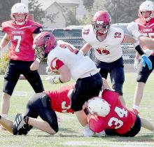 Aiden Jackman and Jacob Held combine to bring down EPPJ’s Jack Wemhoff in the first quarter. Wemhoff was sidelined late in the second quarter with a leg injury after gaining 127 yards in 20 carries and two touchdowns.