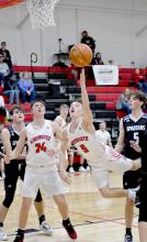 Traegan McNally lays out for two of his 11 points against the Boyd County Spartans. The Dawgs defeated the Spartans 68-34.