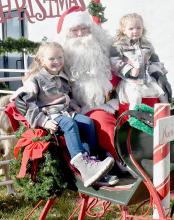Kalli and Kiaire Kempcke took a few minutes to visit with Santa Claus when he was in Ainsworth.