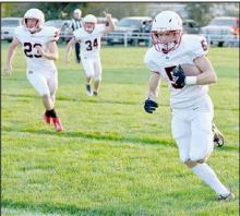 Owen Blumenstock takes the ball around the left end on the first play from scrimmage for the Bulldogs and scores on a 58 yard run.