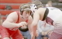 AHS junior Jensen Williams wrestles in the 160 lb. weight class against Brandon Schriner of Gothenburg.