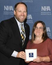 Amanda Tucker received the Caring Kind Award from Jeremy Nordquist, MPA - the NHA President.
