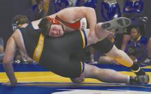 Ainsworth sophomore John Lewis takes down his opponent from West Holt during the West Holt Quadrangular on Thursday, December 4.