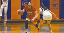 Gracyn Painter dribbles past her opponent during the team’s game in Gordon.