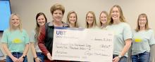 Kathy Klammer, Union Bank &amp; Trust, presented a check to President, Karen O’Hare. Board members present were (Back Row - Left to Right) Chelsey Peterson, Devyn France, Neily Arens, Rylee Pierce, Reagan Fairhead and Marsha Fuchs.