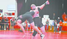 Sophomore Easton McMillin takes down his opponent, Gavin Knajdl of Amherst.
