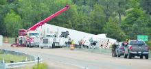 Pictured above is the clean up efforts of several entities removing the truck and trailer on Wednesday, September 17.