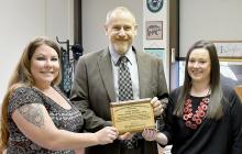 Misty Rowley, Bright Horizons Ainsworth Program Director (left) presented the Outstanding Community Partnership Award to Brown County Attorney Andy Taylor (center) and Brown County Attorney Secretary Michelle Mitchell (right).