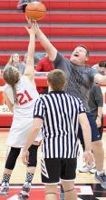 8th Grader Gracyn Painter nearly gets the tip away from staff’s Bruce Mitchell.