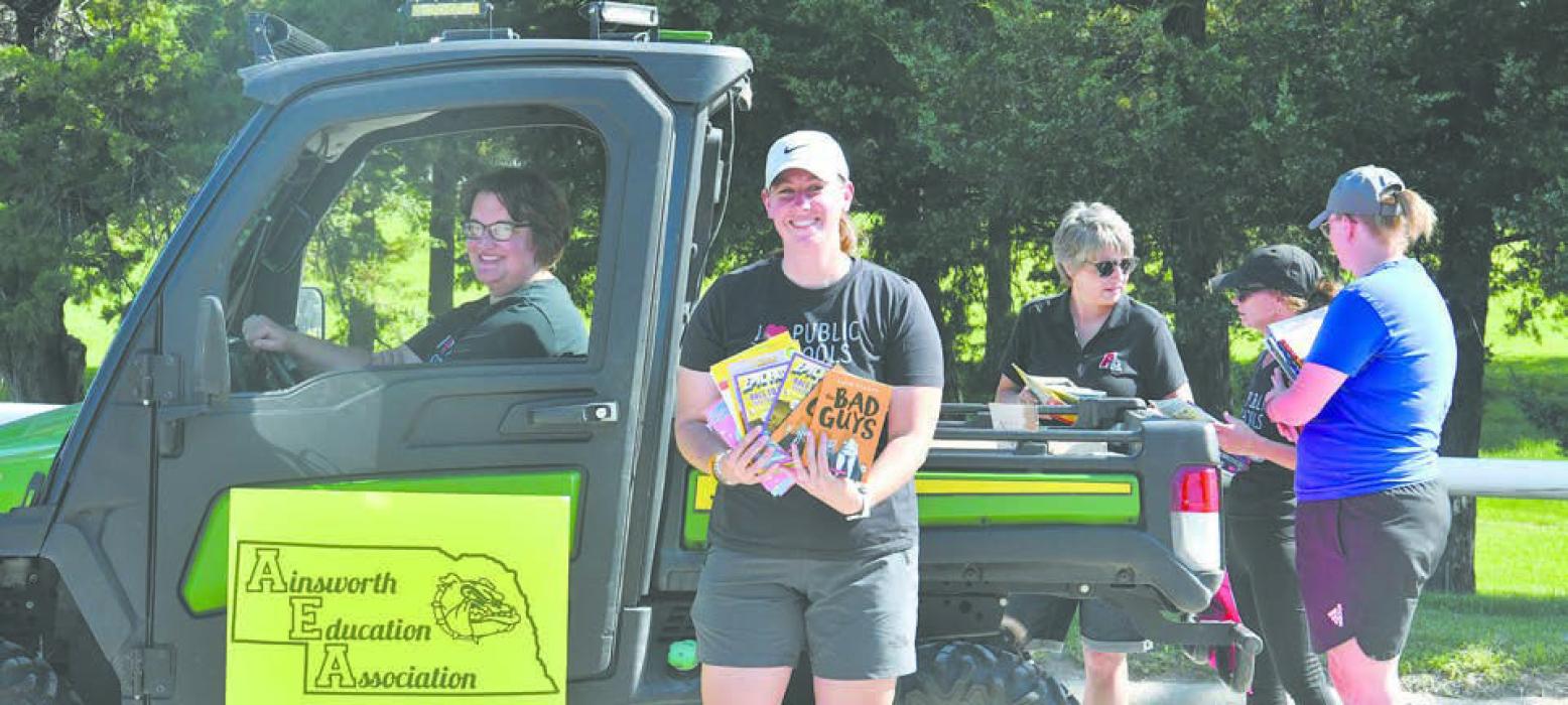 Several ACS staff members passed out books during the parade. Pictured above are Rachel Williams, Heather Lutter, Pam Barrow, Wendy Allen, and Tamara Hancock.