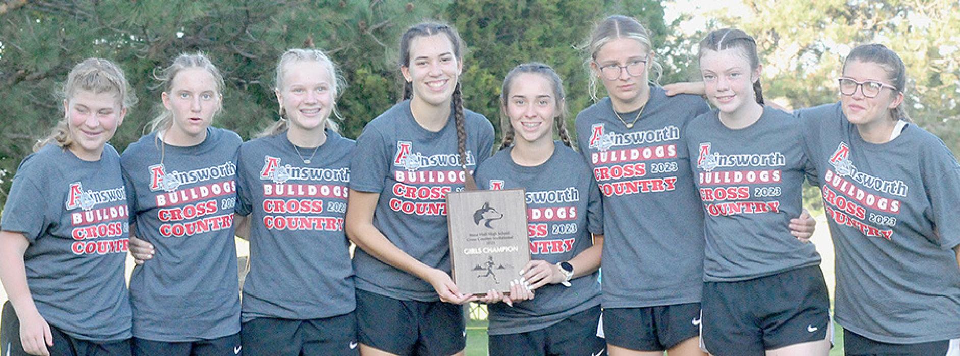 The Ainsworth Girls Cross Country Team ran to first place at the West Holt Cross Country Invitational. Team members are (Left to Right): Cassandra Cole, Preselyn Goochey, Kiley Orton, Katherine Kerrigan, Tessa Barthel, Emma Kennedy, Payton Moody and Jodie Denny.