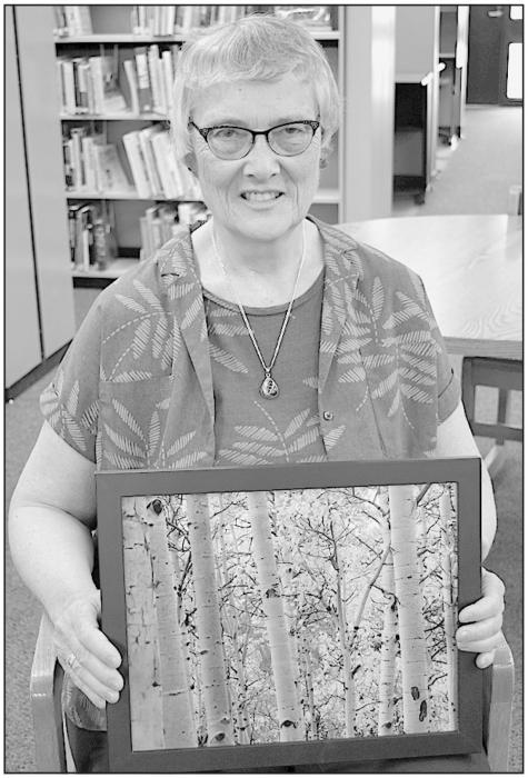 Martha Rasmussen won Best of Show and People’s Choice with her photo entitled “Aspen Forest.”