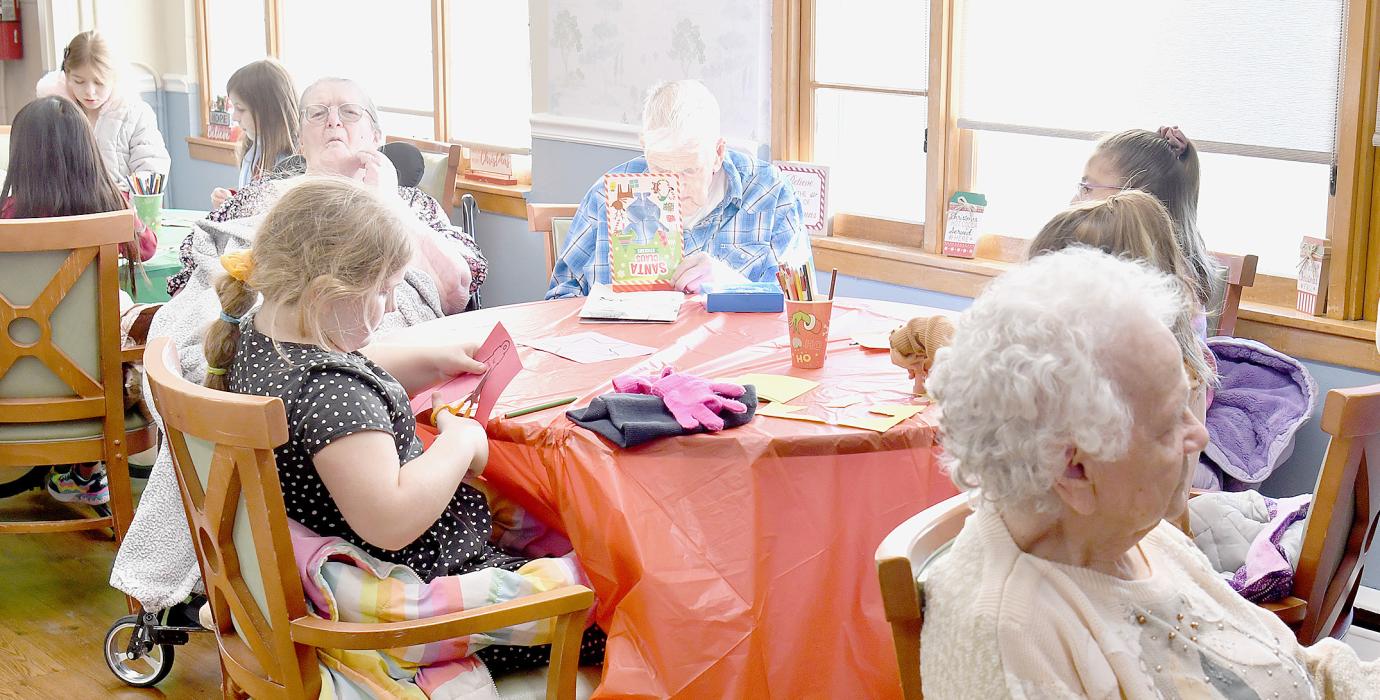 Ainsworth Students Help Brighten the Walls at Sandhills Care Center for the Holidays