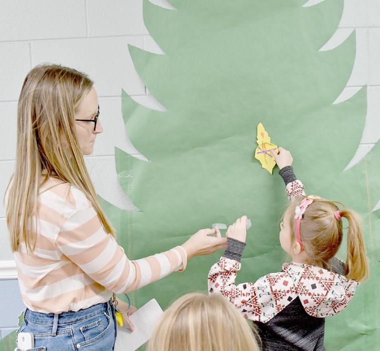 Ainsworth Students Help Brighten the Walls at Sandhills Care Center for the Holidays