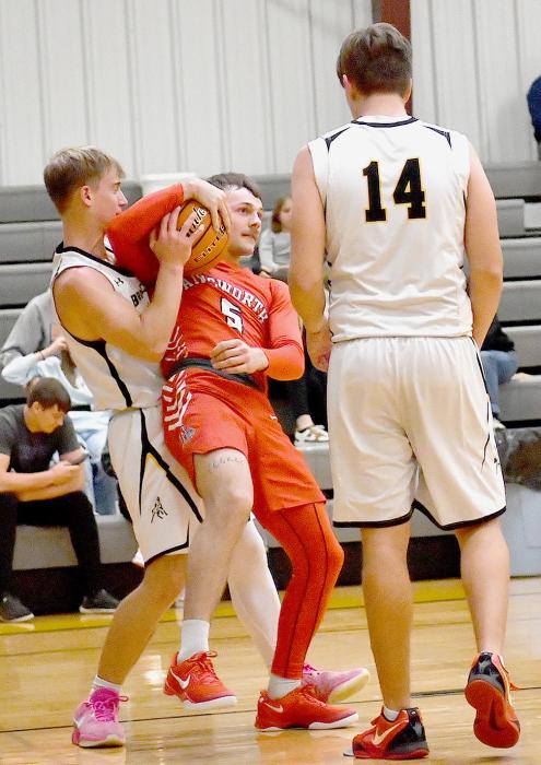 Owen Blumenstock fights for the ball in the game against the Mullen Broncos on January 3rd.