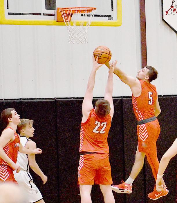 Owen Blumenstock and Witten Painter go up for a rebound against Mullen. Blumenstock led the Dawgs with seven rebounds.