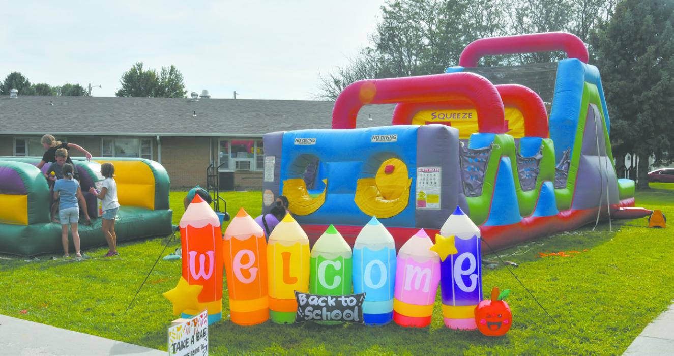 The Sandhills Care Center hosted a back to school bash on August 8. The event had bounce houses, face painting, balloon darts, a hot dog station, and even a mini petting zoo.