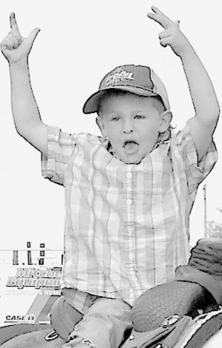 Lower Left: This young man had a great time during Musical Chairs and expressed his enthusiasm after getting one of the open chairs.