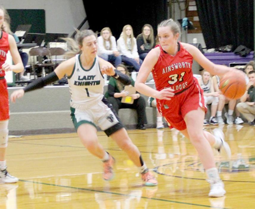 Libby Wilkins drives past a Sandhills/Thedford defender.