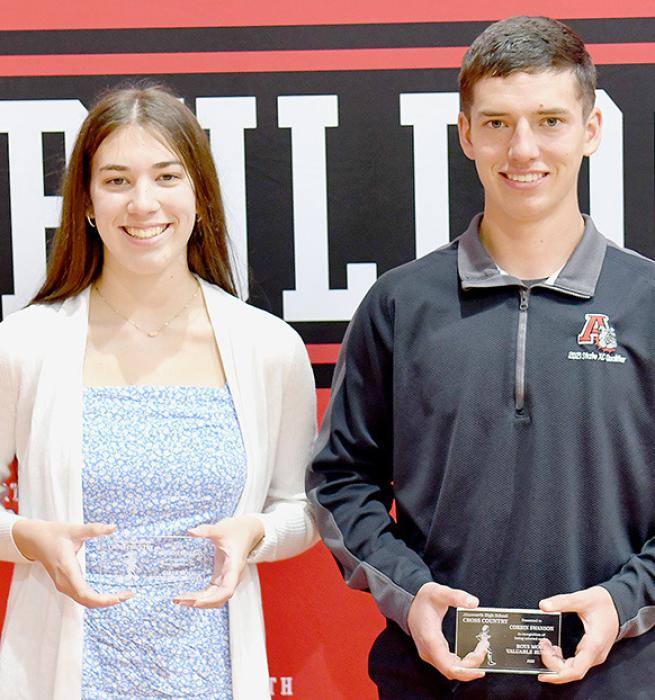Katherine Kerrigan (left) and Corbin Swanson (right) were named Cross Country MVPs by Coach Jared Hansmeyer.