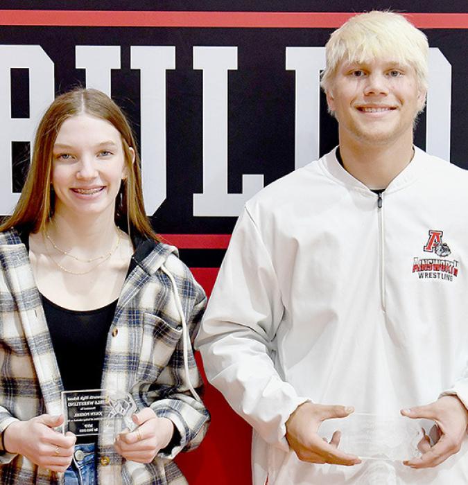 Jolyn Pozehl (left) and Landon Holloway (right) were named the Girls and Boys Wrestling MVP’s by Girls Wrestling Coach Todd Pollock and Boys Wrestling Coach Blaine Finney.