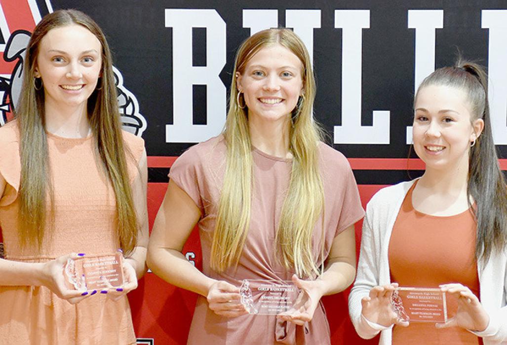 Coach Julie Micheel presented awards for Girls Basketball. Receiving awards were (left to right) Cameryn Goochey Heart Award, Kendyl Delimont - MVP and Breanna Fernau - Heart Award.