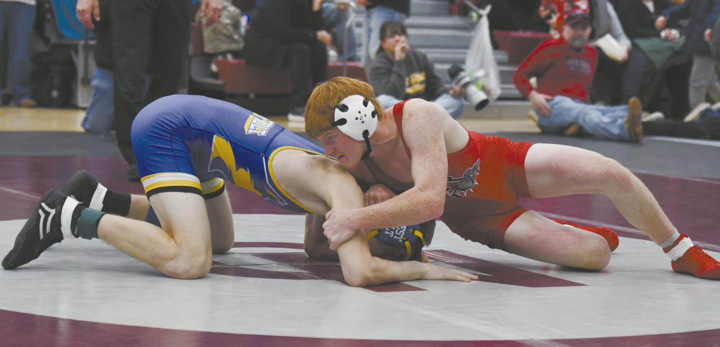 Senior Sam Titus wrestles Hunter Wettlaufer of West Holt. Titus pinned Wettlaufer in 23 seconds.