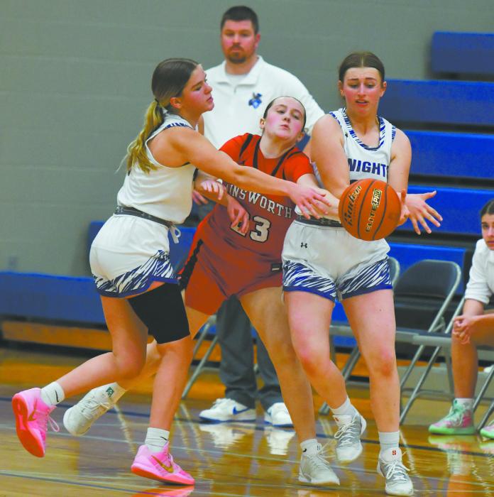 Freshman Payton Sears attempts to intercept a handoff between Reece Taylor and Kit Painter of North Central.