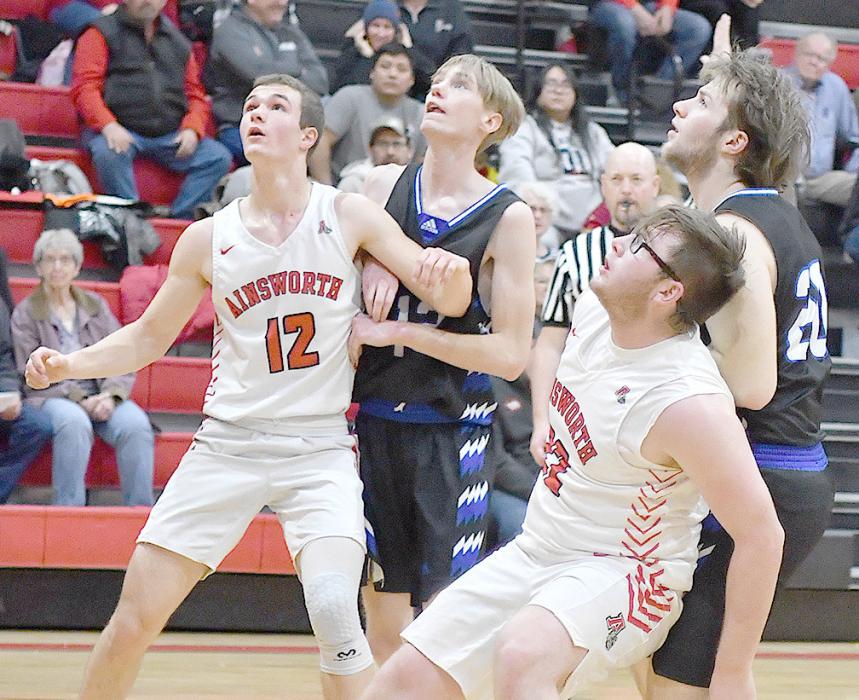 Junior Witten Painter and senior Logan Schroedl box out to gain position against the Knights for a defensive rebound.