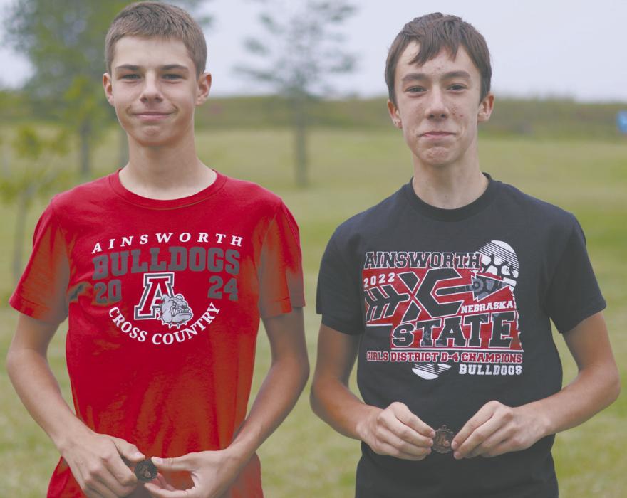 The Ainsworth Boys Cross Country team placed fourth at their home invite. Two runners medaled, Holden Beel (fourth place) and Ryan Kerrigan (16th place).