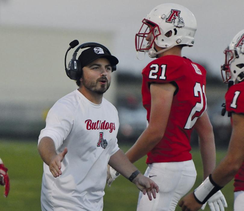 Head Coach Jessi Owen gives his athletes high fives after North Central calls a time-out during Friday night’s game.