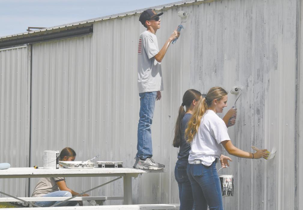 Ainsworth students used betterment day to give back to the community. Students were located in the community parks, Long Pine trails, the golf course, and some visited the area’s senior centers. Pictured above are students from Mrs. Dowdy’s group of students painting a shade area near the Baseball fields.