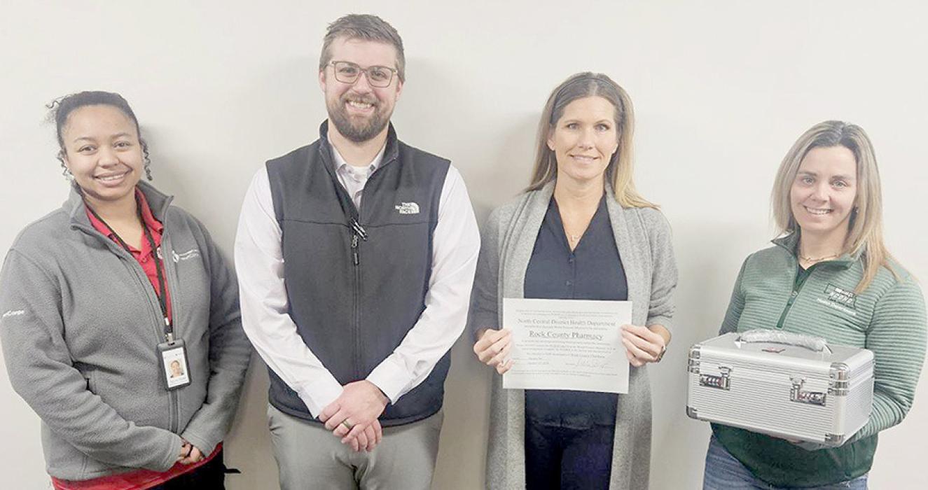Presenting and receiving the blood pressure device were (Left to Right) TyLinn Dodd, Joshua Coyle - PharmD, Michelle Sinsel - RPh and Kelli Dempster.