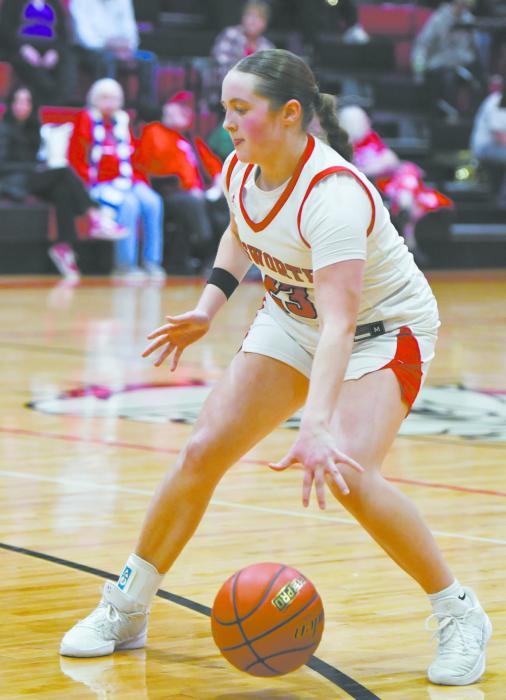 Ainsworth freshman Payton Sears dribbles the ball across the three-point line. Sears had three points during the team’s game against Boyd County.
