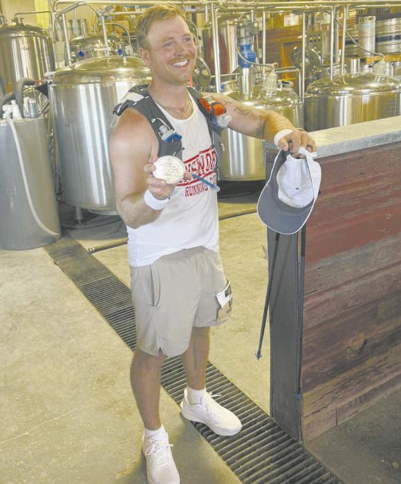 Nick Martin was awarded a medal for completing the ultramarathon. Photo Courtsey of Ashley Martin