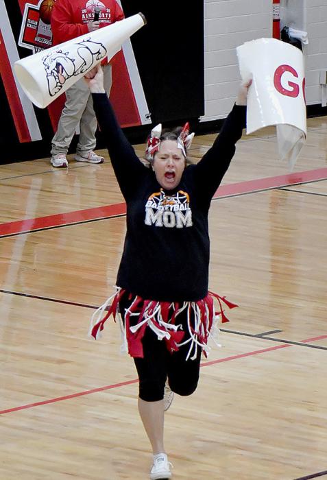 In preparation of heading to the State Basketball Tournament, a Pep Rally was held at McAndrew Gymnasium on March 5th. Mothers of the Boys Basketball Team performed a skit. Jamie Kinney was in fine form as a cheerleader as part of the skit. Also performing were the band and cheerleaders.
