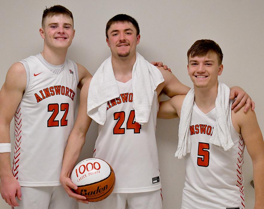 Trey Appelt (center) joined two other teammates by scoring 1,000 points during his career as an Ainsworth Bulldog. Appelt achieved 1,000 career points during the Bulldogs win over Guardian Angel Central Catholic. Appelt joins Carter Nelson (left) and Traegan McNally (right) in achieving 1,000 career points as Ainsworth Bulldogs.