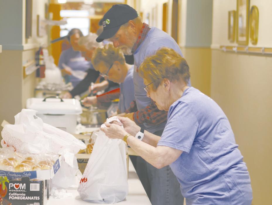 Volunteers from the church gave their time on Christmas Day to put together to-go boxes for the drive through. The event was held in the church’s parking lot from 11 a.m. to noon.