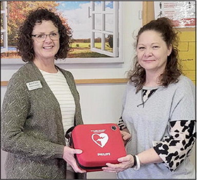 Brown County Ambulance Association President Ann Fiala presented a Heart-Start AED to ACSC Administrator Briana Lawrenz to be placed in the Senior Center building.