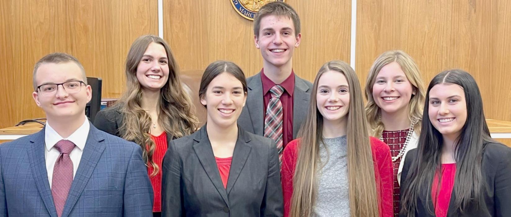 Qualifying members of the Ainsworth Blue Mock Trial team are: (Front Row - Left to Right): Gavin Olinger, Katherine Kerrigan, Taylor Allen and Dakota Stutzman; (Back Row - Left to Right): Haley Schroedl, Benjamin Flynn and Alyssa Erthum.