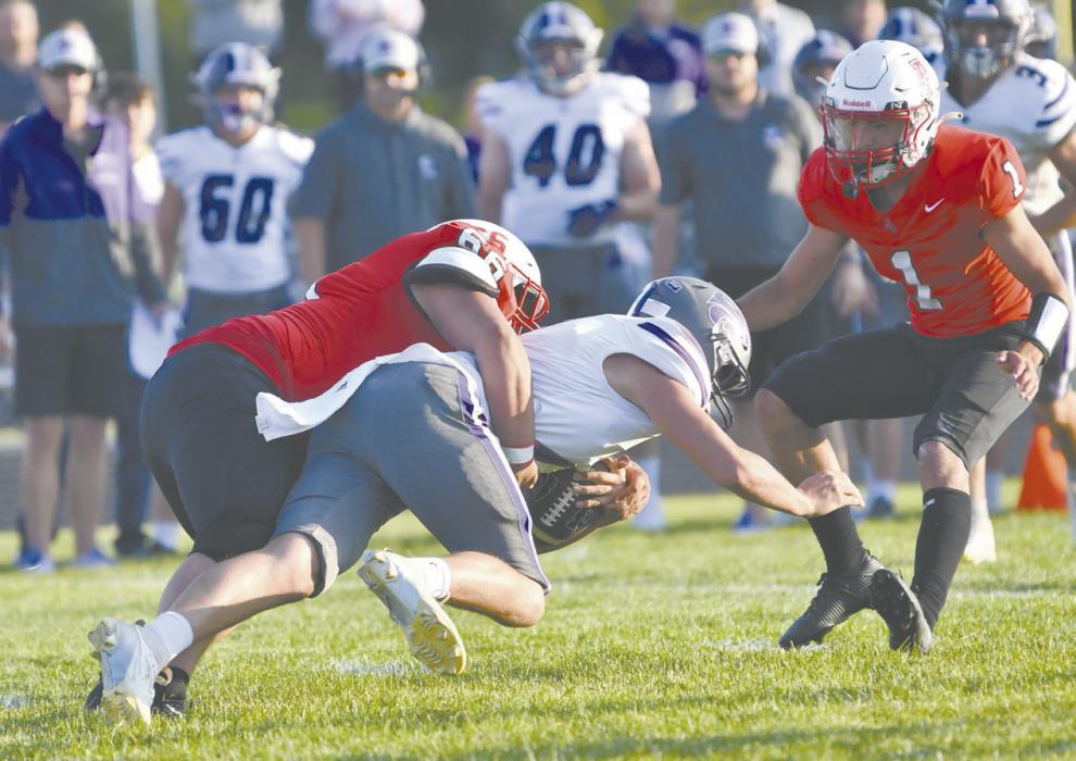 Senior Trevor Pike tackles a Wildcat carrying the football. Pike had four tackles during the Bulldos fgirst game of the year.