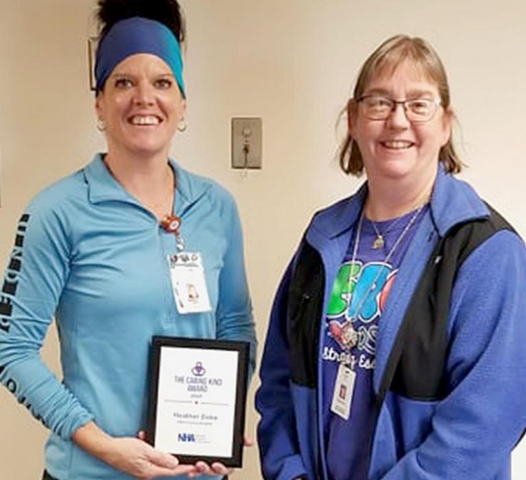Heather Doke (left) received her award at the Rock County Hospital and is pictured with facility administrator Stacey Knox (right). Heather, husband Scott and their family live near Newport.
