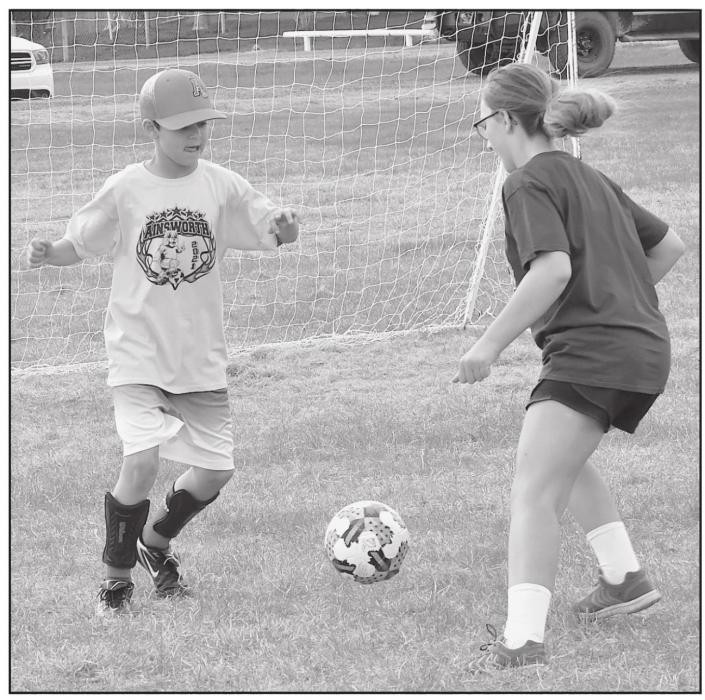 Drew Palmer squares off against Addilyn Doke during the 3rd/4th grade game on April 30th.