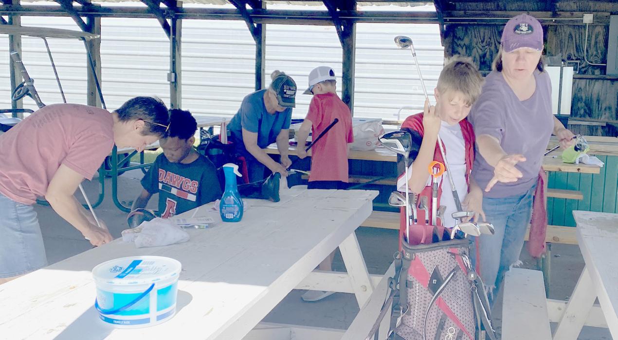 National History Day Students Tee Off Successful Women’s League Golf Club Cleaning Fundraiser