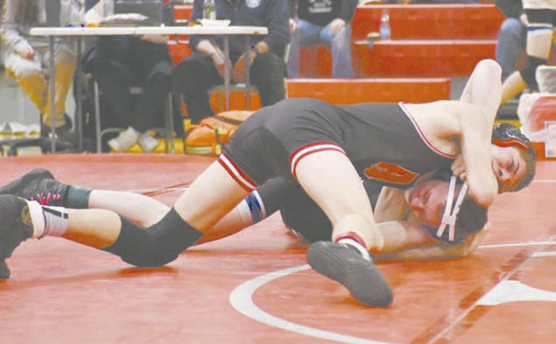 Holden Beel works to pin an opponent in a match last season. He was one of two NSAA Boys State Wrestling Qualifiers last season.