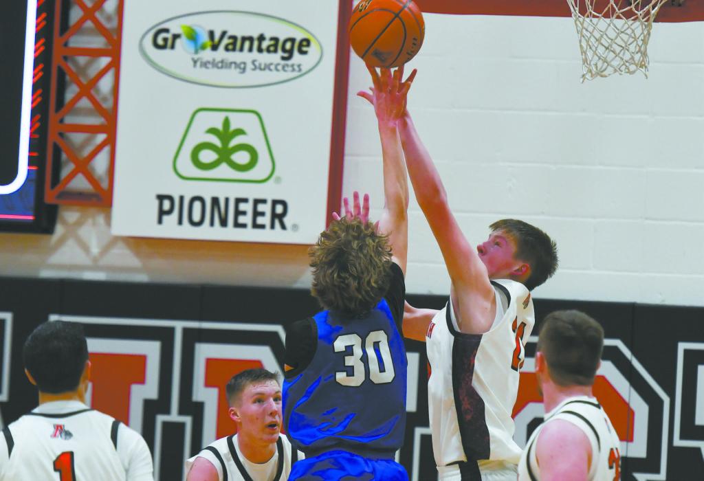 Sophomore Jaxon Rucker attempts to block Niobrara/Verdigre’s Parker Frank.