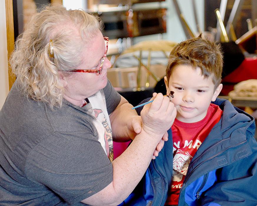 Face Painting was also offered to the young people following their visit with Santa. Gavin Marlatt was very patient while having a snowman painted on his face.